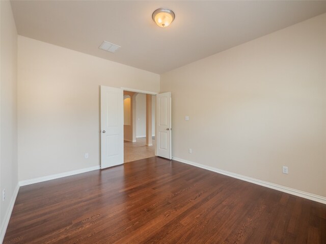 457 Monahans Dr, Georgetown, TX 78628 - spare room featuring wood finished floors and arched walkways