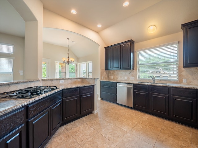 457 Monahans Dr, Georgetown, TX 78628 - kitchen with black gas stovetop, stainless steel dishwasher, decorative backsplash, lofted ceiling, and a chandelier
