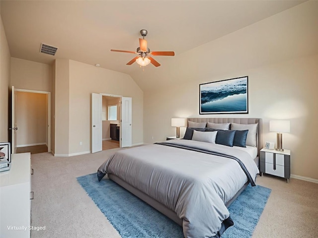 457 Monahans Dr, Georgetown, TX 78628 - bedroom with light carpet, vaulted ceiling, ensuite bathroom, and a ceiling fan