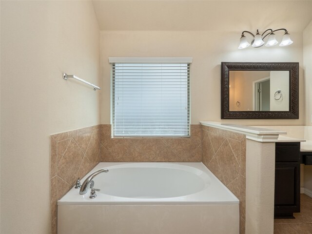 457 Monahans Dr, Georgetown, TX 78628 - full bathroom featuring vanity and a garden tub