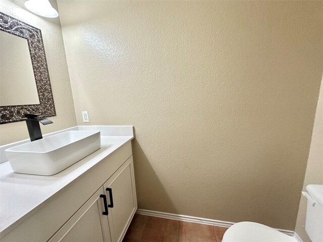 6116 Speyside Dr, Austin, TX 78754 - bathroom with vanity, a textured wall, and tile patterned floors