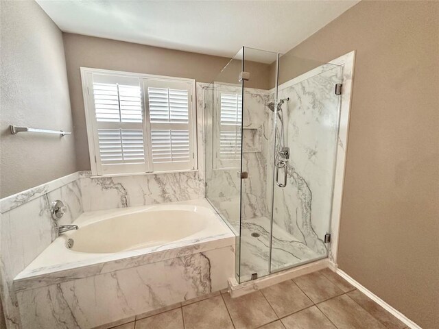 6116 Speyside Dr, Austin, TX 78754 - full bathroom with a marble finish shower, a garden tub, and tile patterned floors