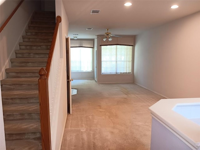 12401 Los Indios Trl Unit 9, Austin, TX 78729 - staircase with a ceiling fan, carpet, and recessed lighting