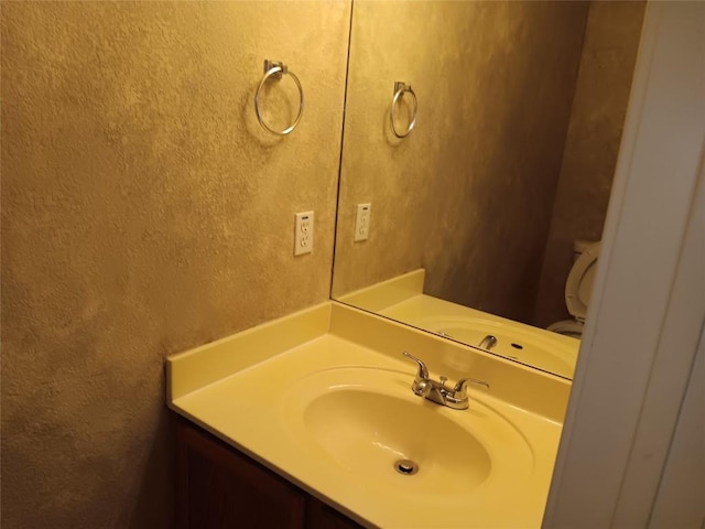 12401 Los Indios Trl Unit 9, Austin, TX 78729 - bathroom featuring vanity and a textured wall