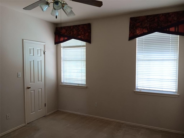 12401 Los Indios Trl Unit 9, Austin, TX 78729 - carpeted spare room with a ceiling fan and baseboards