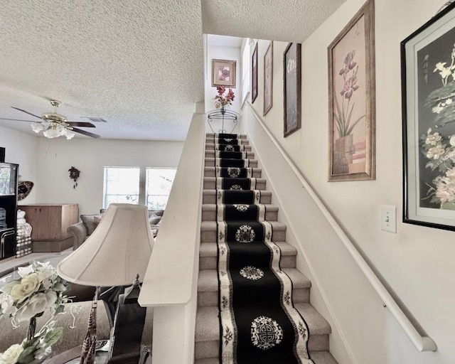 15304 Iola Cv, Austin, TX 78717 - stairway featuring a textured ceiling and ceiling fan