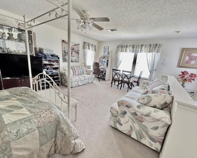 15304 Iola Cv, Austin, TX 78717 - bedroom featuring a textured ceiling, carpet floors, and a ceiling fan