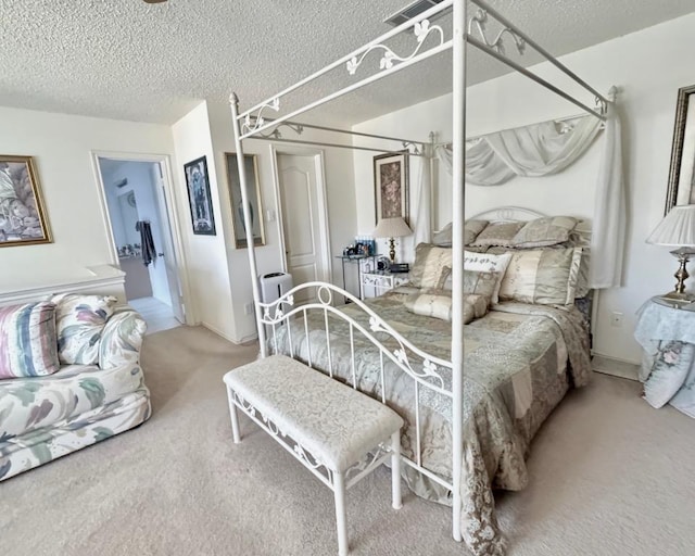 15304 Iola Cv, Austin, TX 78717 - bedroom with carpet flooring and a textured ceiling
