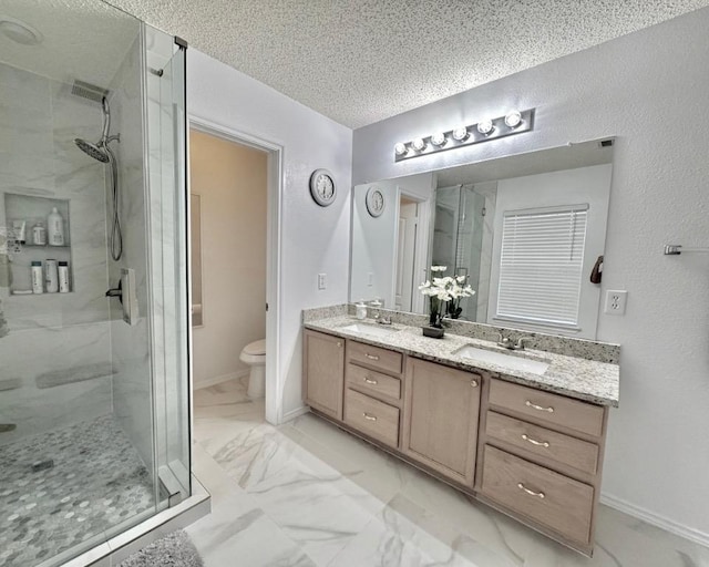 15304 Iola Cv, Austin, TX 78717 - full bathroom featuring a stall shower, marble look tiles, a textured ceiling, and double vanity