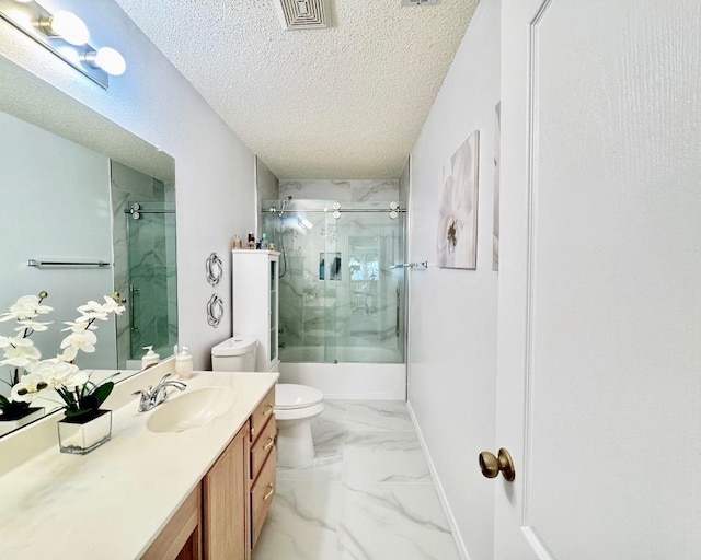 15304 Iola Cv, Austin, TX 78717 - bathroom featuring a textured ceiling, vanity, marble look tiles, and bath / shower combo with glass door