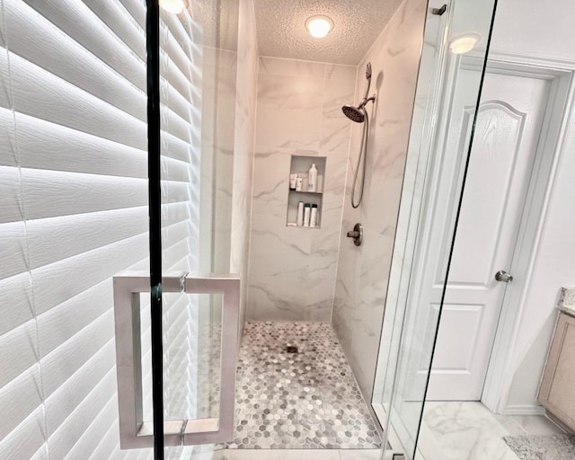 15304 Iola Cv, Austin, TX 78717 - full bath with a marble finish shower, a textured ceiling, and vanity