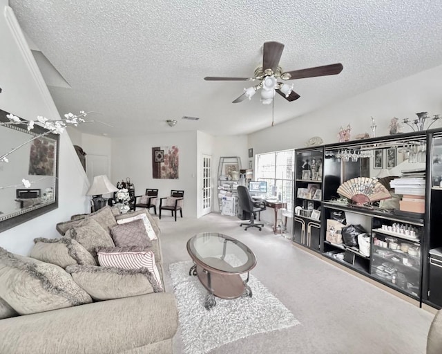 15304 Iola Cv, Austin, TX 78717 - living area with an office area, a textured ceiling, ceiling fan, carpet flooring, and french doors