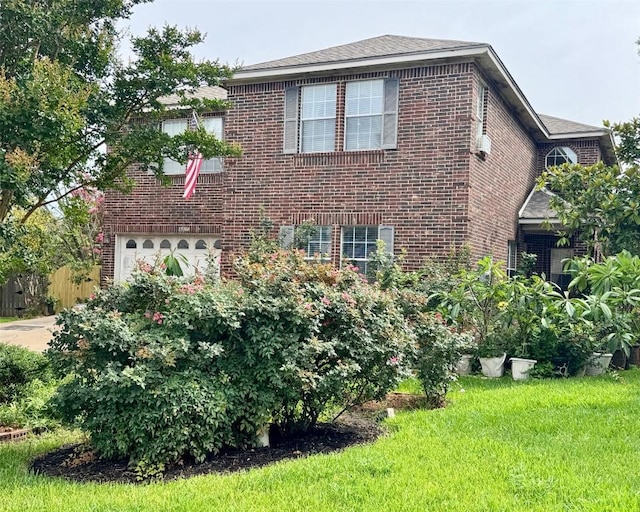 15304 Iola Cv, Austin, TX 78717 - view of property exterior featuring a garage, brick siding, and a lawn