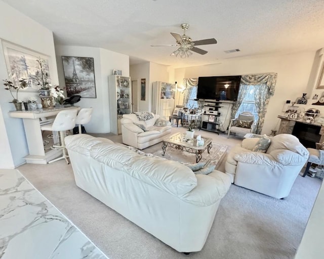 15304 Iola Cv, Austin, TX 78717 - living room with a ceiling fan, a textured ceiling, and marble finish flooring