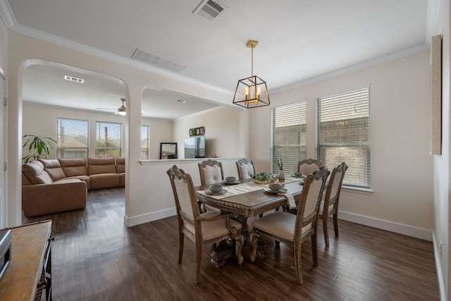808 Lonesome Lilly Way, Pflugerville, TX 78660 - dining room featuring crown molding, arched walkways, dark wood-style floors, and ceiling fan