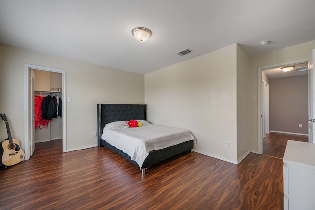 808 Lonesome Lilly Way, Pflugerville, TX 78660 - bedroom with wood finished floors, a spacious closet, and a closet