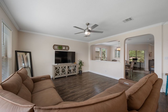 808 Lonesome Lilly Way, Pflugerville, TX 78660 - living area with dark wood finished floors, ceiling fan, arched walkways, and crown molding