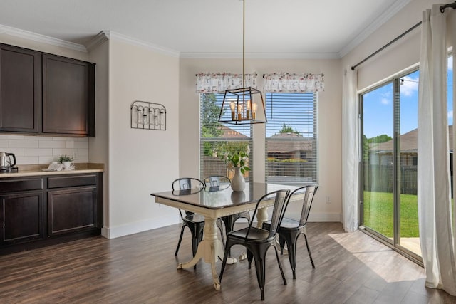 808 Lonesome Lilly Way, Pflugerville, TX 78660 - dining room with dark wood-style floors, crown molding, and a chandelier