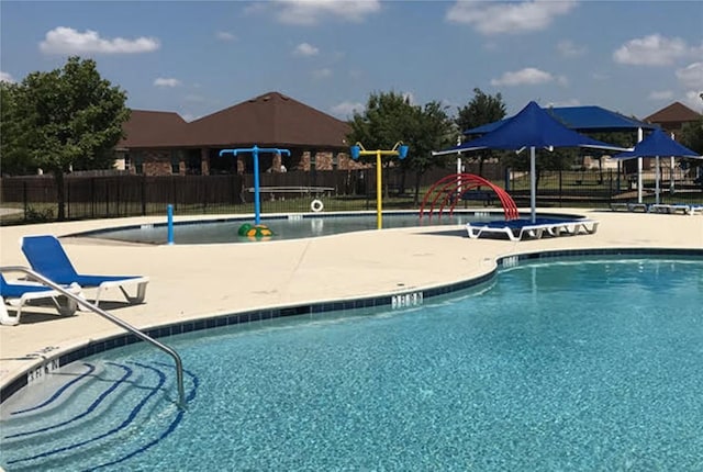 808 Lonesome Lilly Way, Pflugerville, TX 78660 - community pool featuring a patio