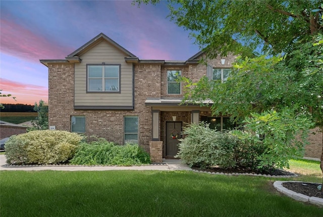 808 Lonesome Lilly Way, Pflugerville, TX 78660 - view of front facade with brick siding and a front lawn