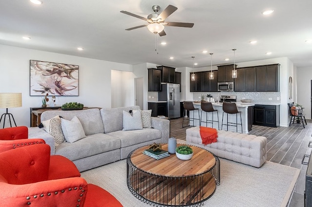 1700 Lorant Ln, Pflugerville, TX 78660 - living area featuring a ceiling fan, recessed lighting, and light wood-style floors
