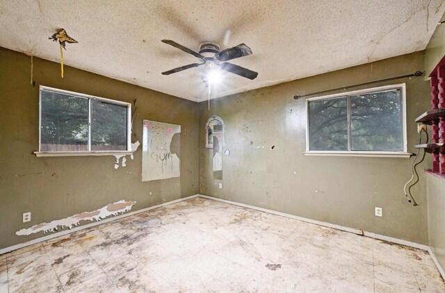 10410 Margra Ln, Austin, TX 78748 - unfurnished room with a ceiling fan and a textured ceiling
