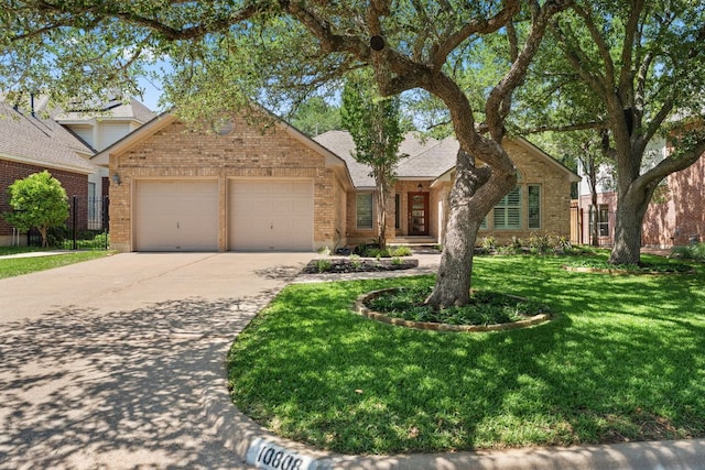 10808 Redmond Rd, Austin, TX 78739 - view of front of home featuring an attached garage, brick siding, concrete driveway, a front yard, and a shingled roof