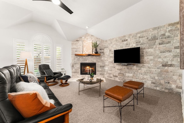 10808 Redmond Rd, Austin, TX 78739 - carpeted living room with lofted ceiling, ceiling fan, and a stone fireplace