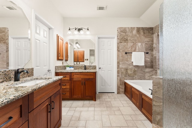 10808 Redmond Rd, Austin, TX 78739 - bathroom featuring a tub to relax in and two vanities