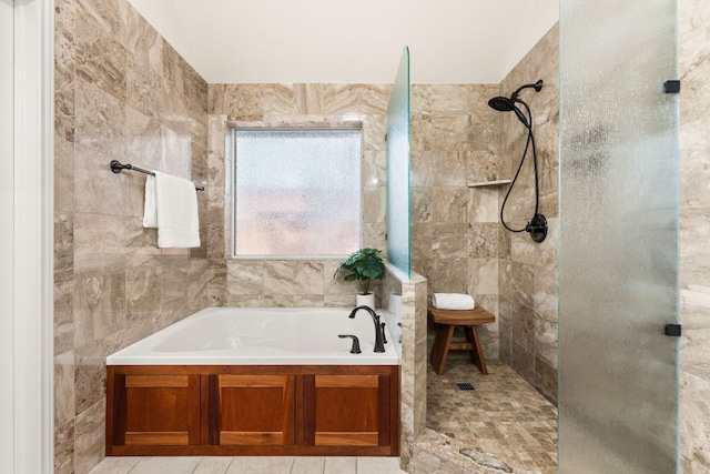 10808 Redmond Rd, Austin, TX 78739 - full bath with a tile shower, a garden tub, and tile walls