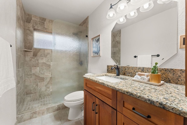 10808 Redmond Rd, Austin, TX 78739 - full bath with vanity, tiled shower, and tile patterned flooring