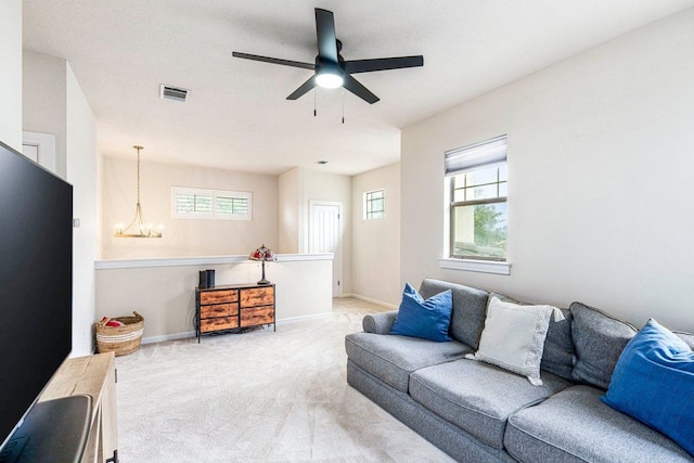 3 Stillmeadow Ct, The Hills, TX 78738 - living room with carpet floors, healthy amount of natural light, ceiling fan, and a chandelier