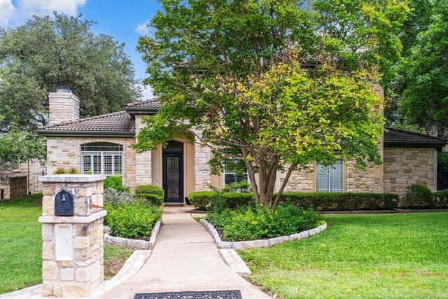 3 Stillmeadow Ct, The Hills, TX 78738 - view of front of property with stone siding and a front lawn