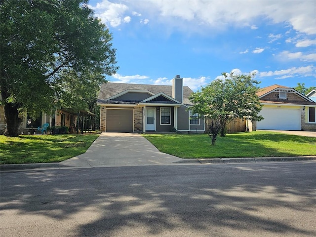 1111 Fairlawn Cv, Round Rock, TX 78664 - view of front of property with driveway, an attached garage, a front lawn, and a chimney