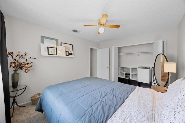 1111 Fairlawn Cv, Round Rock, TX 78664 - carpeted bedroom featuring ceiling fan, a closet, and a textured ceiling