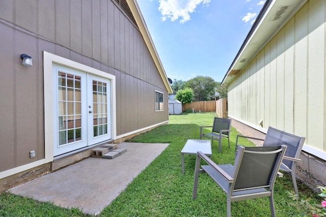 1111 Fairlawn Cv, Round Rock, TX 78664 - view of yard with french doors, a patio area, and a storage unit