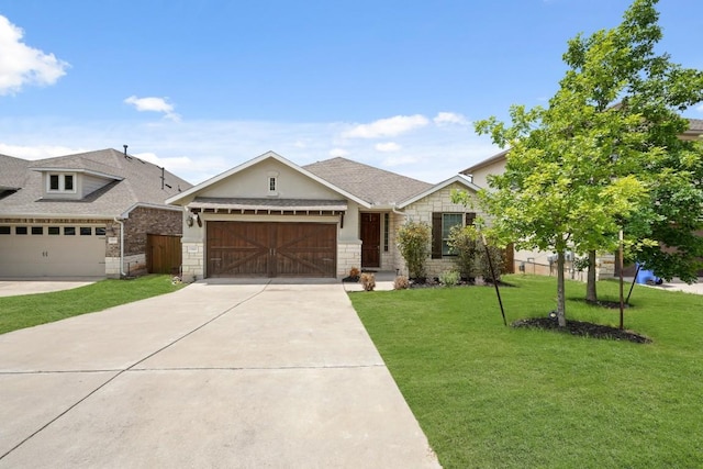 15617 Cinca Terra Dr, Bee Cave, TX 78738 - view of front of property with a front lawn, a garage, concrete driveway, and stone siding