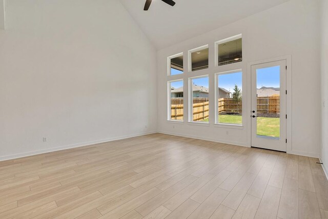 418 Darley Oak Dr, Dripping Springs, TX 78620 - empty room with a ceiling fan, high vaulted ceiling, and light wood-type flooring