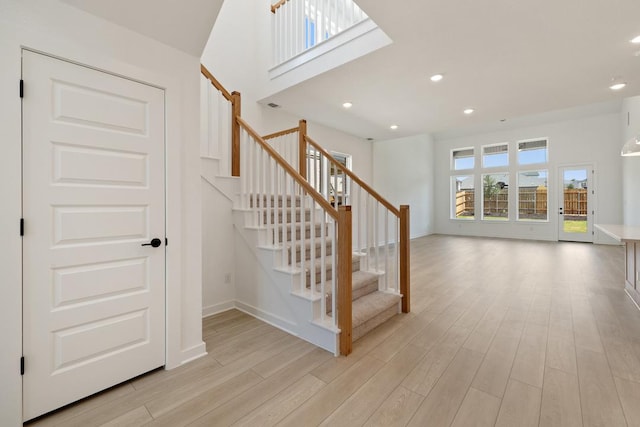 418 Darley Oak Dr, Dripping Springs, TX 78620 - stairway featuring wood finished floors and recessed lighting