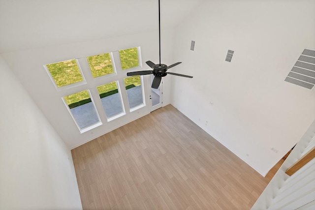 418 Darley Oak Dr, Dripping Springs, TX 78620 - unfurnished living room featuring high vaulted ceiling, a ceiling fan, and light wood-style flooring