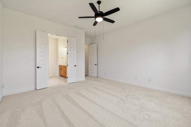 418 Darley Oak Dr, Dripping Springs, TX 78620 - unfurnished bedroom featuring light colored carpet, connected bathroom, and a ceiling fan