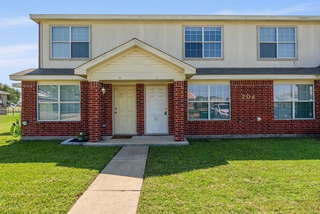 204 Meadowview Ln, Gatesville, TX 76528 - view of front of property with a front yard and brick siding
