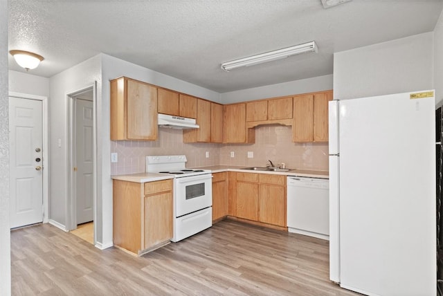204 Meadowview Ln, Gatesville, TX 76528 - kitchen with white appliances, under cabinet range hood, a textured ceiling, light wood-style floors, and light countertops