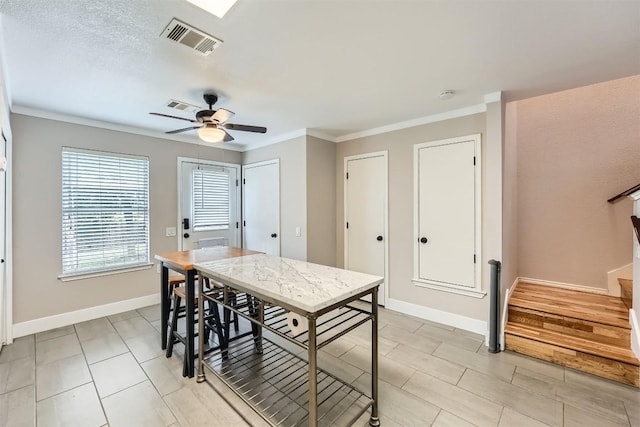 17729 Golden Valley Dr, Manor, TX 78653 - dining space featuring ornamental molding, ceiling fan, light tile patterned floors, and stairway
