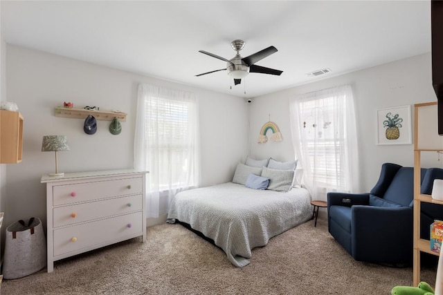 7619 Scenic Brook Dr, Austin, TX 78736 - bedroom featuring multiple windows, light carpet, and a ceiling fan