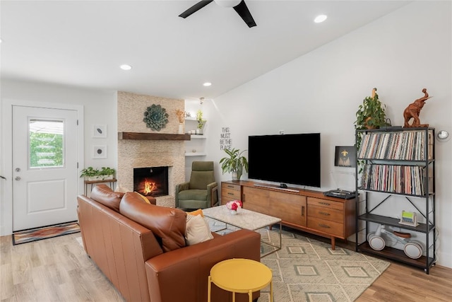 7619 Scenic Brook Dr, Austin, TX 78736 - living area featuring light wood-style floors, a large fireplace, a ceiling fan, and recessed lighting