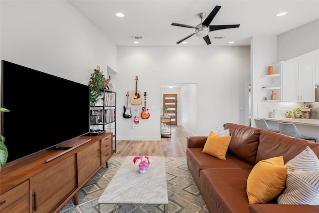 7619 Scenic Brook Dr, Austin, TX 78736 - living room with a high ceiling, light wood-style flooring, a ceiling fan, and recessed lighting
