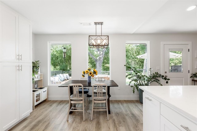 7619 Scenic Brook Dr, Austin, TX 78736 - dining room featuring light wood-style floors and healthy amount of natural light