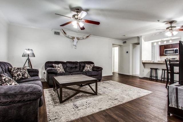 501 W 26th St Unit 105, Austin, TX 78705 - living area with a ceiling fan, crown molding, and dark wood finished floors