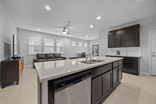 2424 Pecan Island Dr, Leander, TX 78641 - kitchen with stainless steel dishwasher, light tile patterned floors, recessed lighting, a kitchen island with sink, and open floor plan